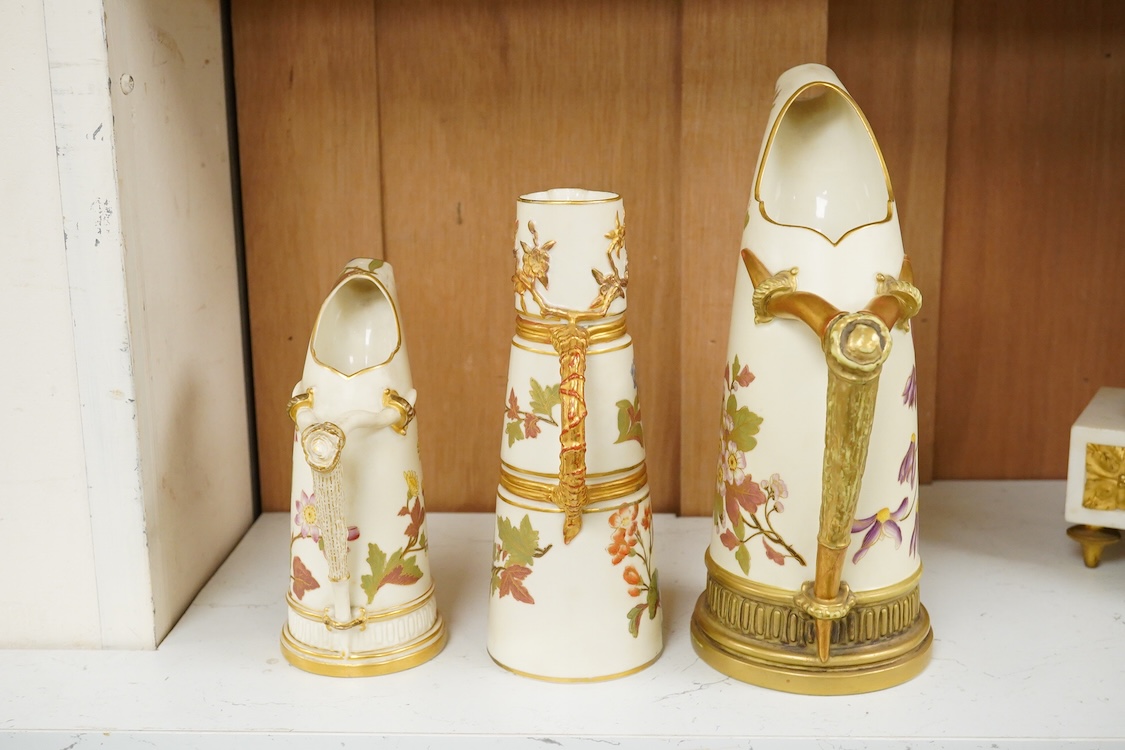Two graduated Royal Worcester jugs, shape 1116, and another, shape 1047
